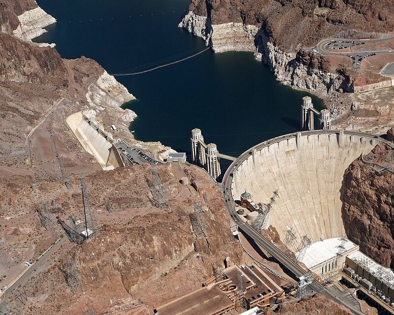 Aerial view of an arch dam and its reservoir